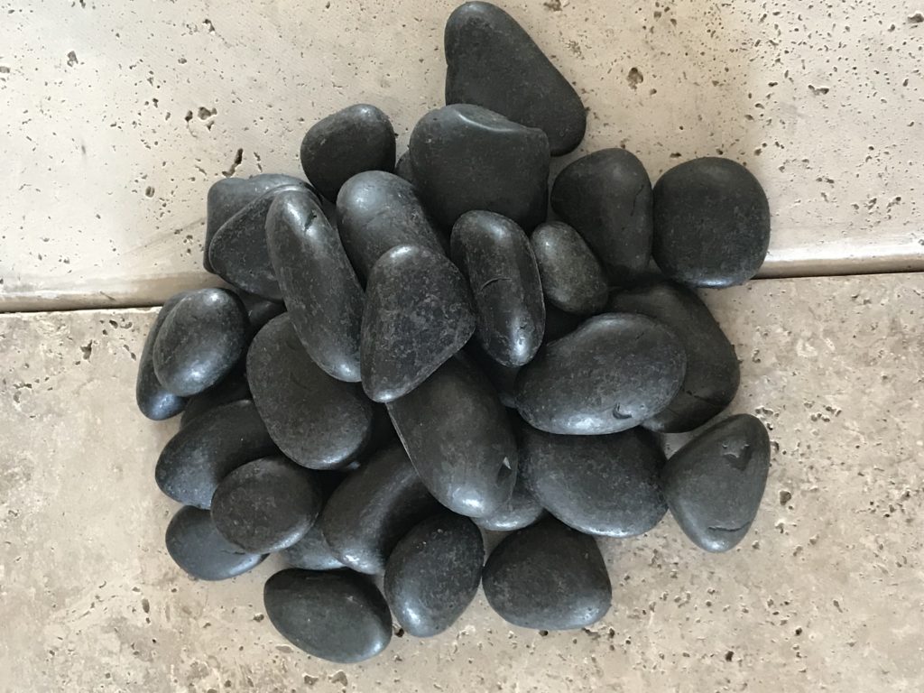 polished black beach pebbles